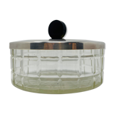 Vintage box made of chiseled glass and covered metal, taken in black Bakelite