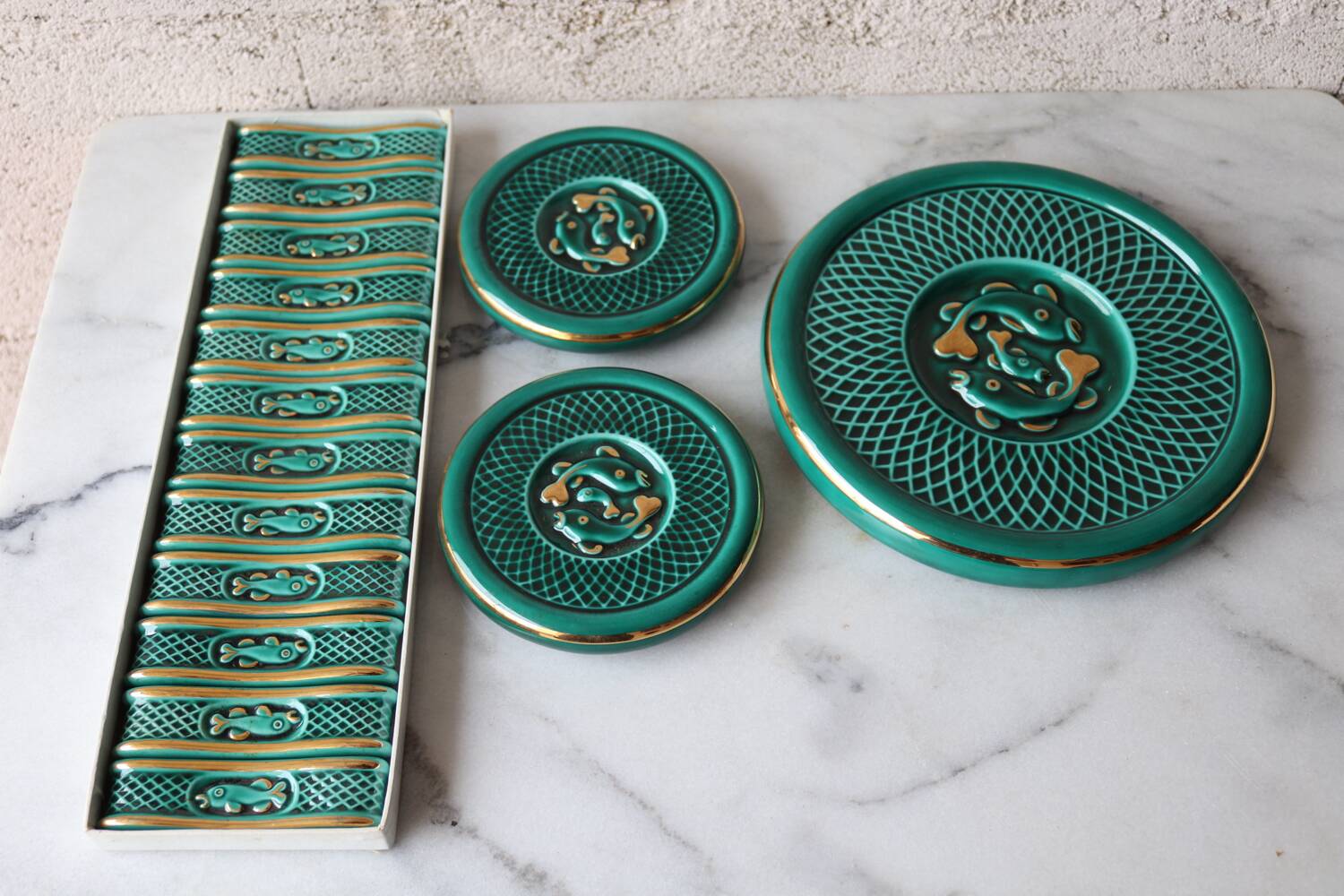 Set of trivets / bottle knife holder barbotine from the 1950s.