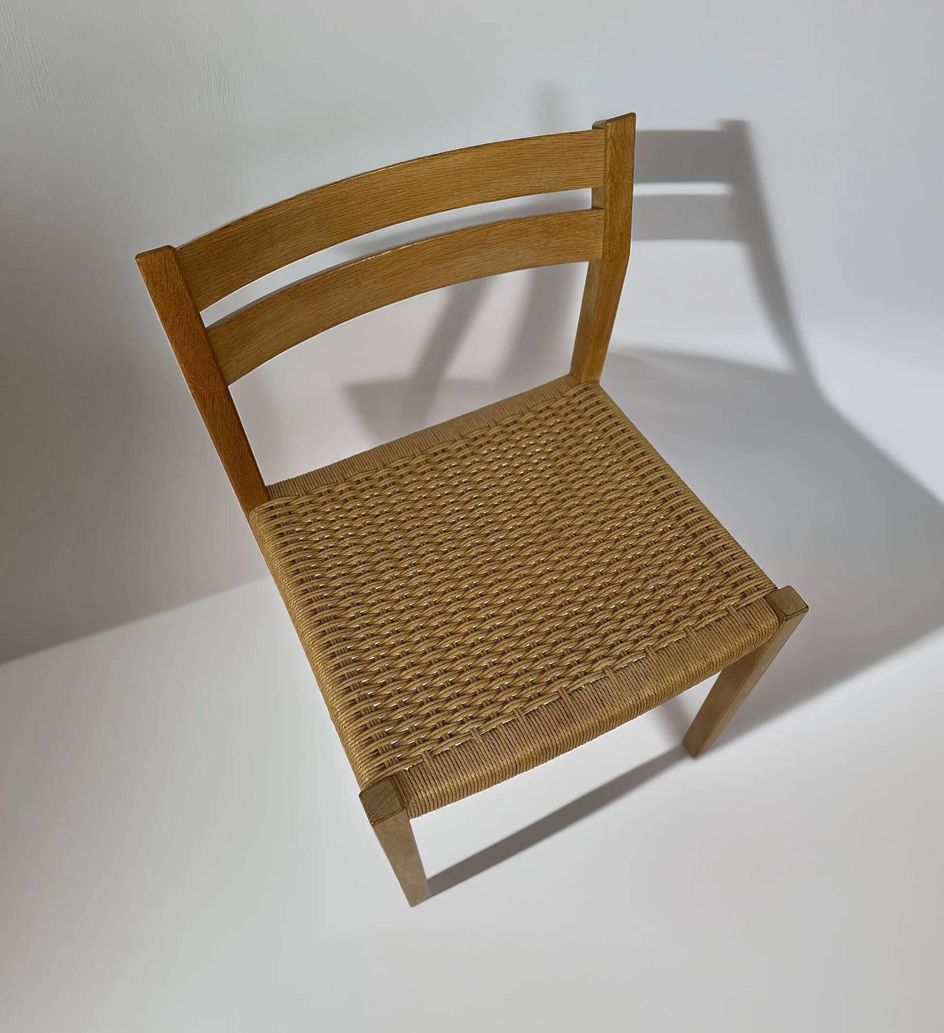 Dining chairs J.H. Møller model 401 in oak with original Danish cord — Denmark, 1970s