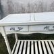 Console in painted wood, off-white patina, 3 drawers, lower shelf.