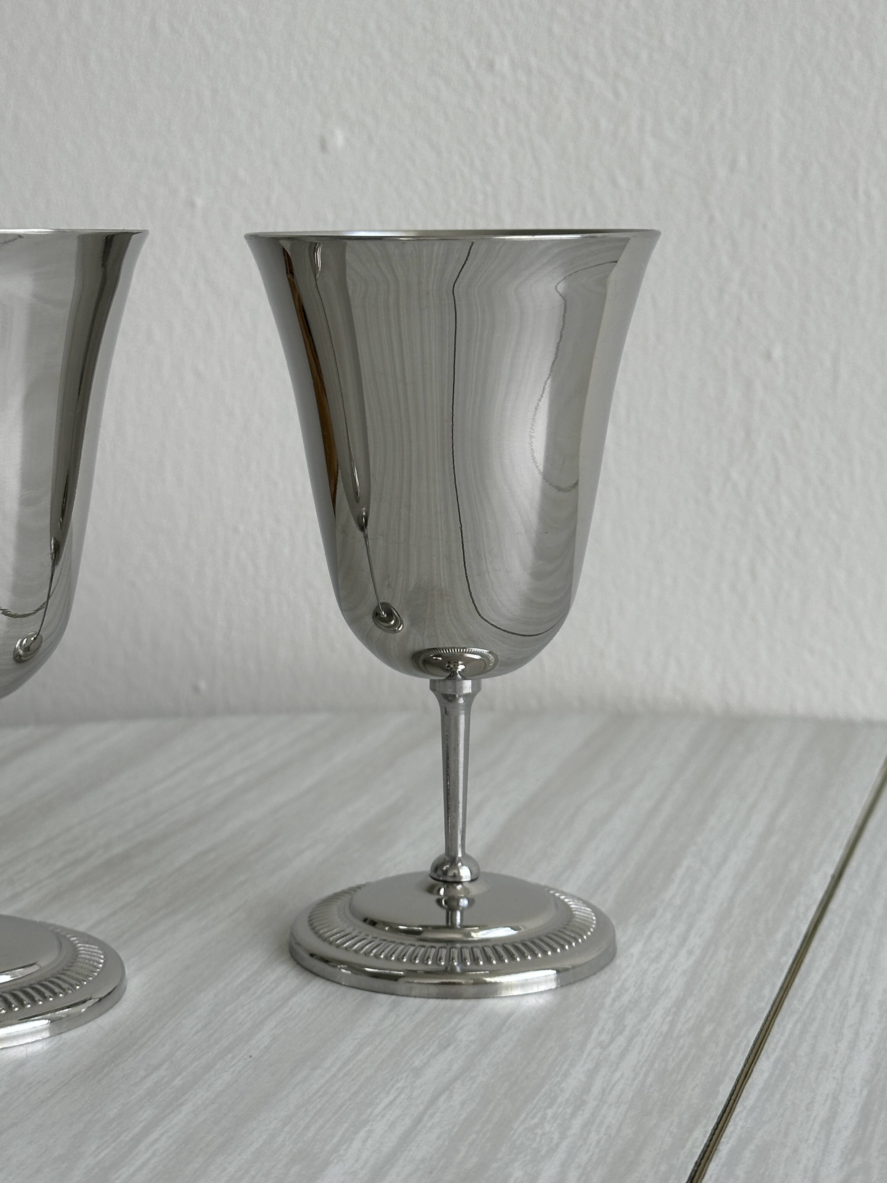 Two metal cups