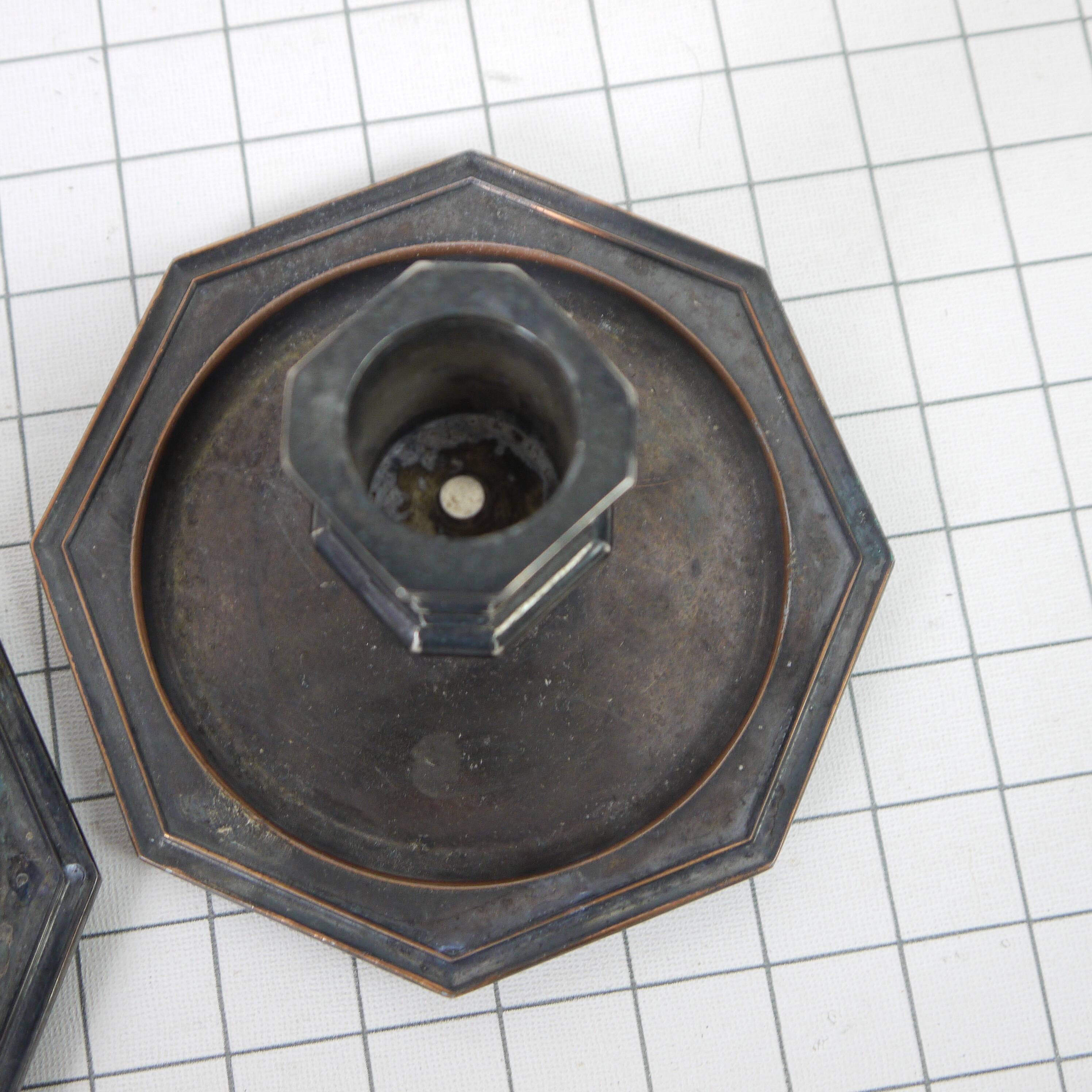 Pair of metal candlesticks