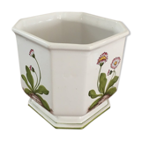 Cover - white ceramic pot decorated with stylized flowers.