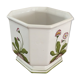 Cover - white ceramic pot decorated with stylized flowers.