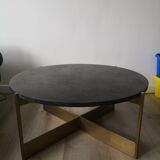 Round coffee table with a metal base and a blue stone top.