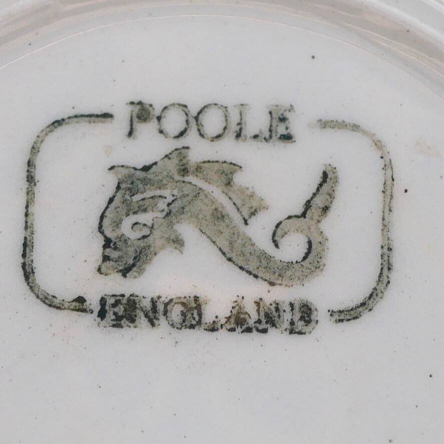 A pair of vintage bright yellow Poole Pottery - Two cups, saucers and ace