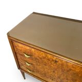 Veneered burl walnut chest of drawers with light warm brown glass top