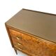 Veneered burl walnut chest of drawers with light warm brown glass top