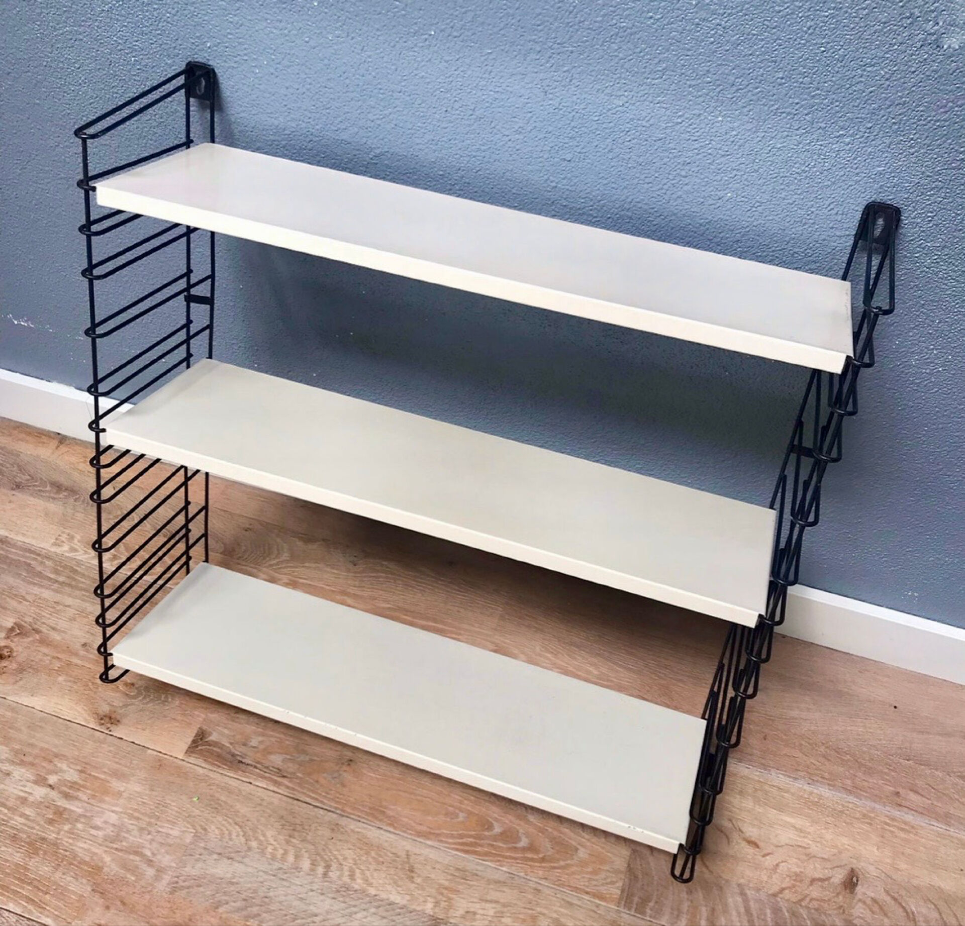 TOMADO — Modular wall shelf, design from 1958