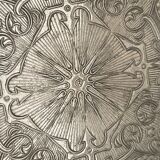 Silvered metal table mat