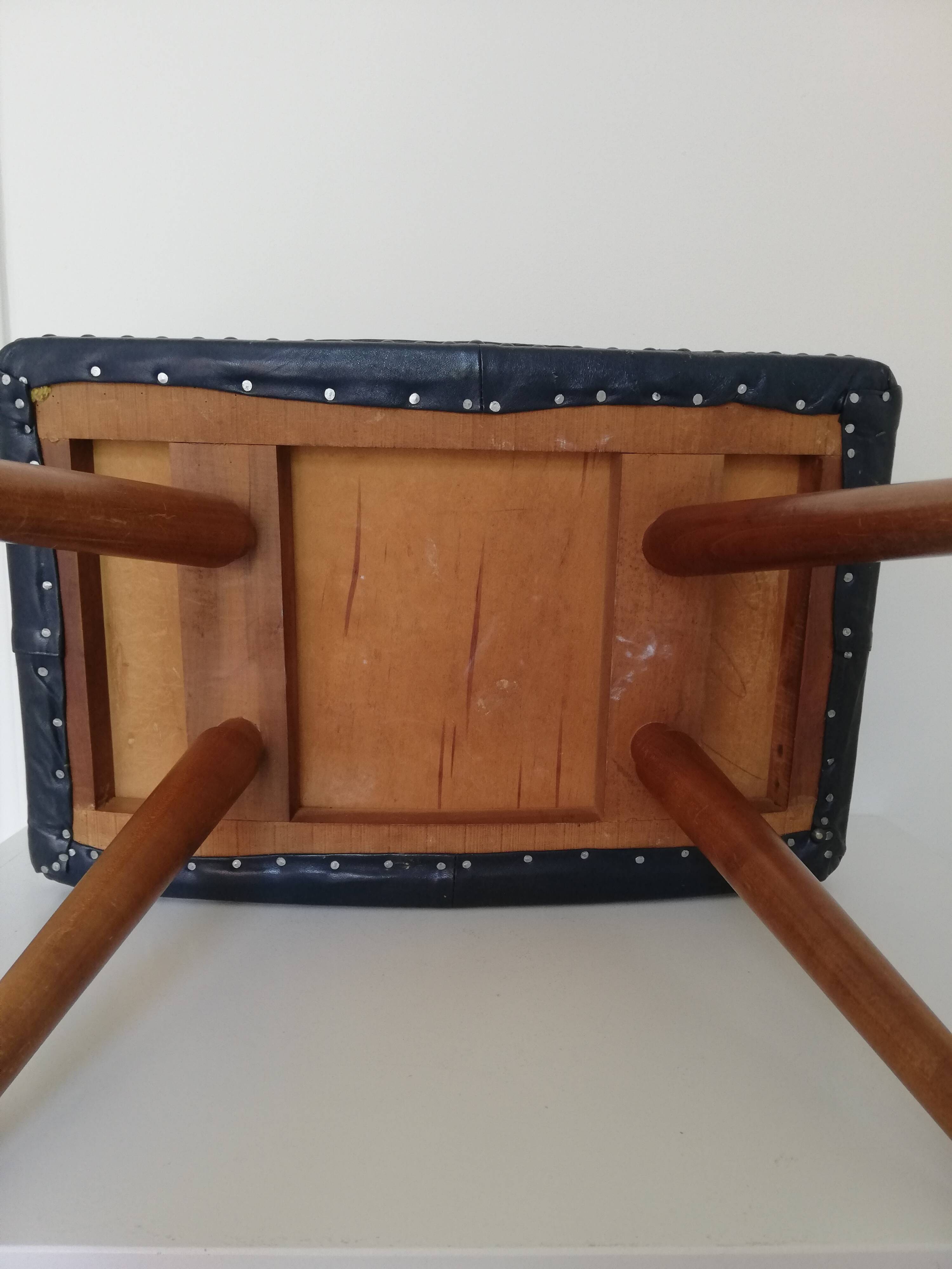 Dark blue leather stool with studs