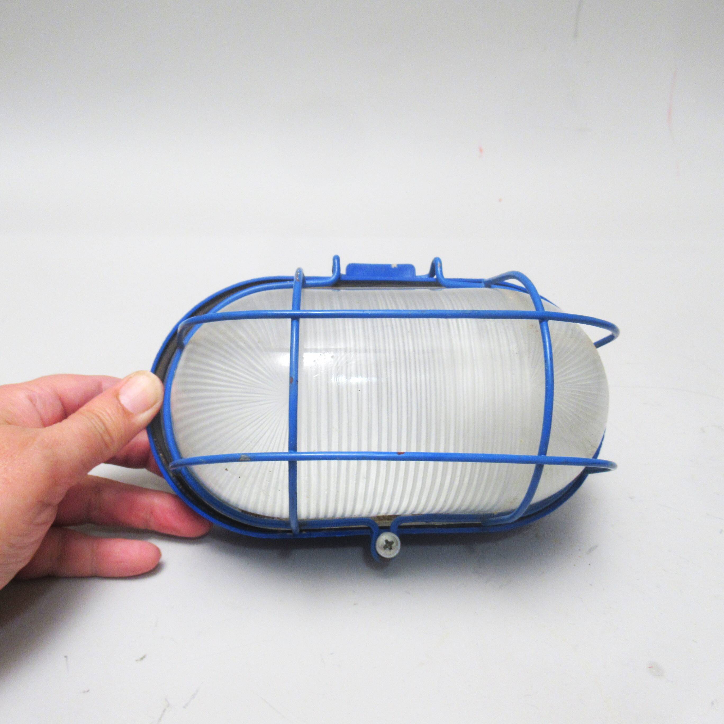 Blue industrial wall or ceiling light.