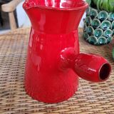 Ancient pitcher in red enamelled sandstone