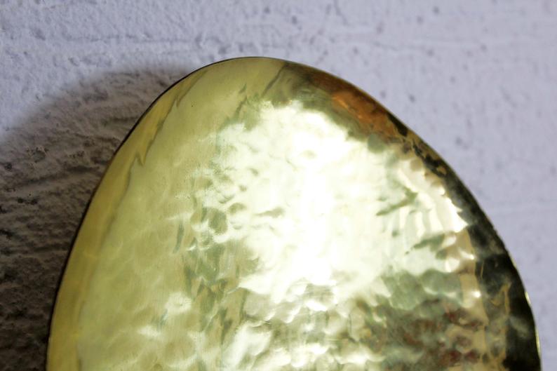 Hammered brass and perforated metal sconce