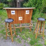 Vintage rattan bar with 1960s earthenware tile decor with 2 stools