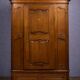 Armoire bonnetière ancienne en merisier et marquéterie – Style Louis XIV