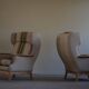 Pair of high-back lounge chairs in modern Danish style in the manner of Henning Kjærnulf, 1960s.