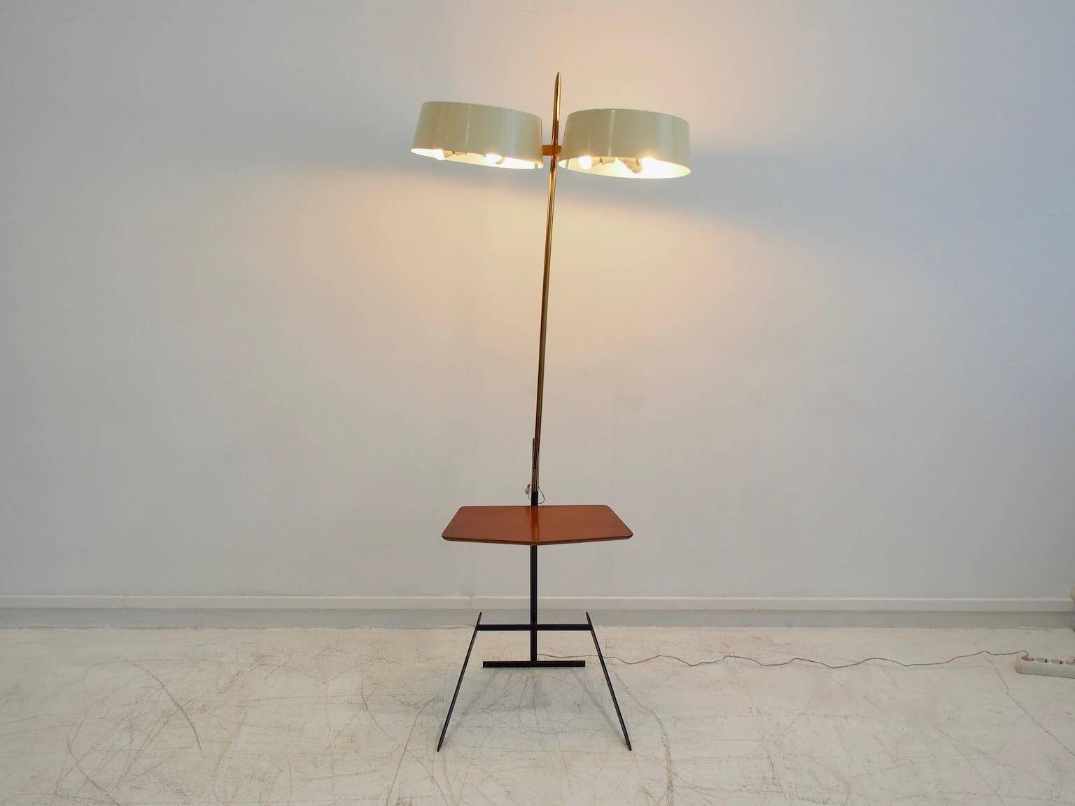 Brass and lacquered metal floor lamp with a wooden magazine shelf.