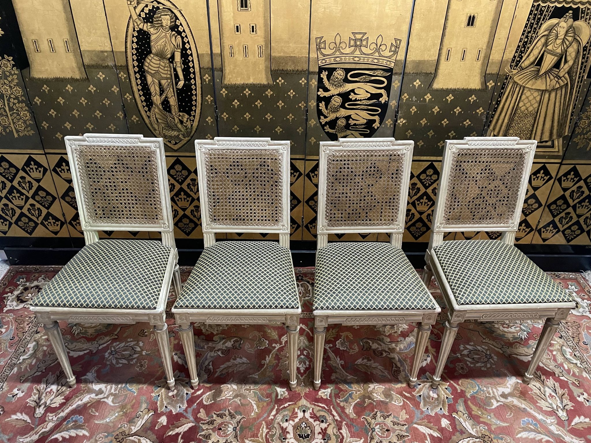 Suite de 4 chaises cannées style Louis XVI Jean Mocque