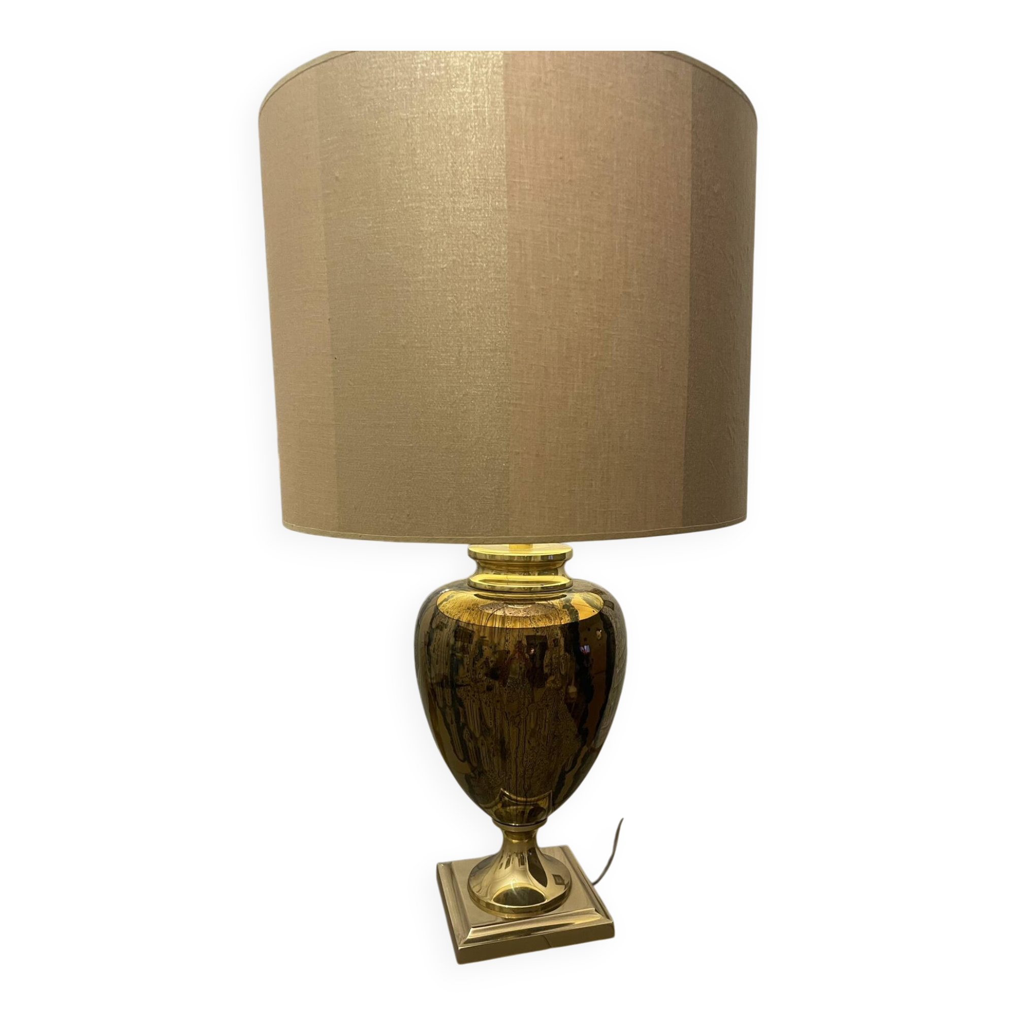 Bronze table lamp with a golden shade.