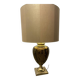Bronze table lamp with a golden shade.