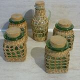 Set of 4 pots and 1 decanter with caps and braiding