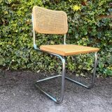 Wooden chair with caning in the style of Marcel Breuer.
