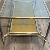 Coffee table in brass, brushed steel, glass, and gilded eglomisé mirror from Maison Jansen.