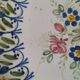 Hand-painted earthenware plate, floral bouquet
