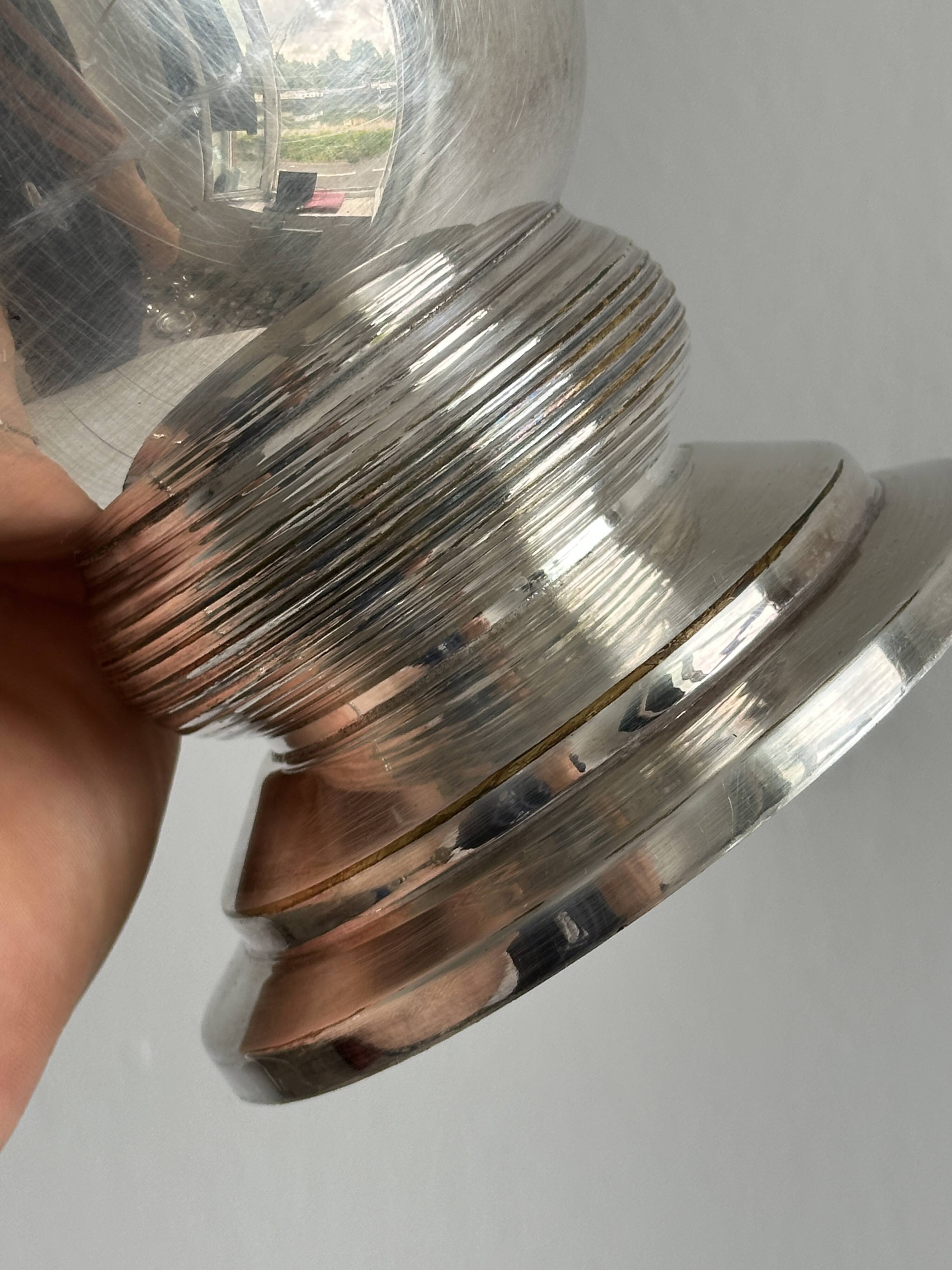 Antique shiny metal vase