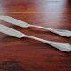 Christofle - Set of 2 fish knives, Rubans croisés model, in silver-plated metal