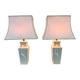 Pair of large cream ceramic table lamps with relief peacocks and fabric shades