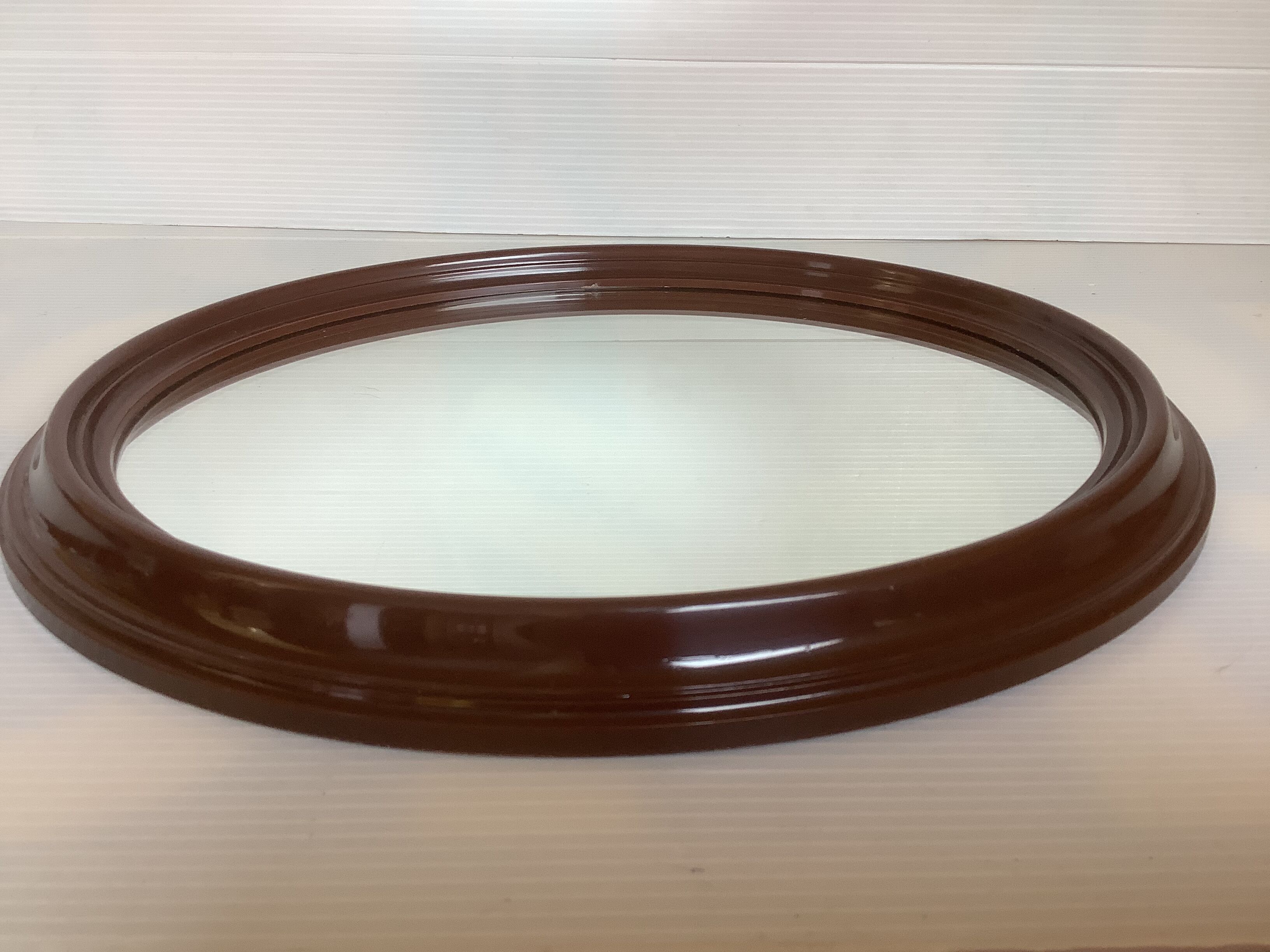 Brown plastic oval mirror made in belgium