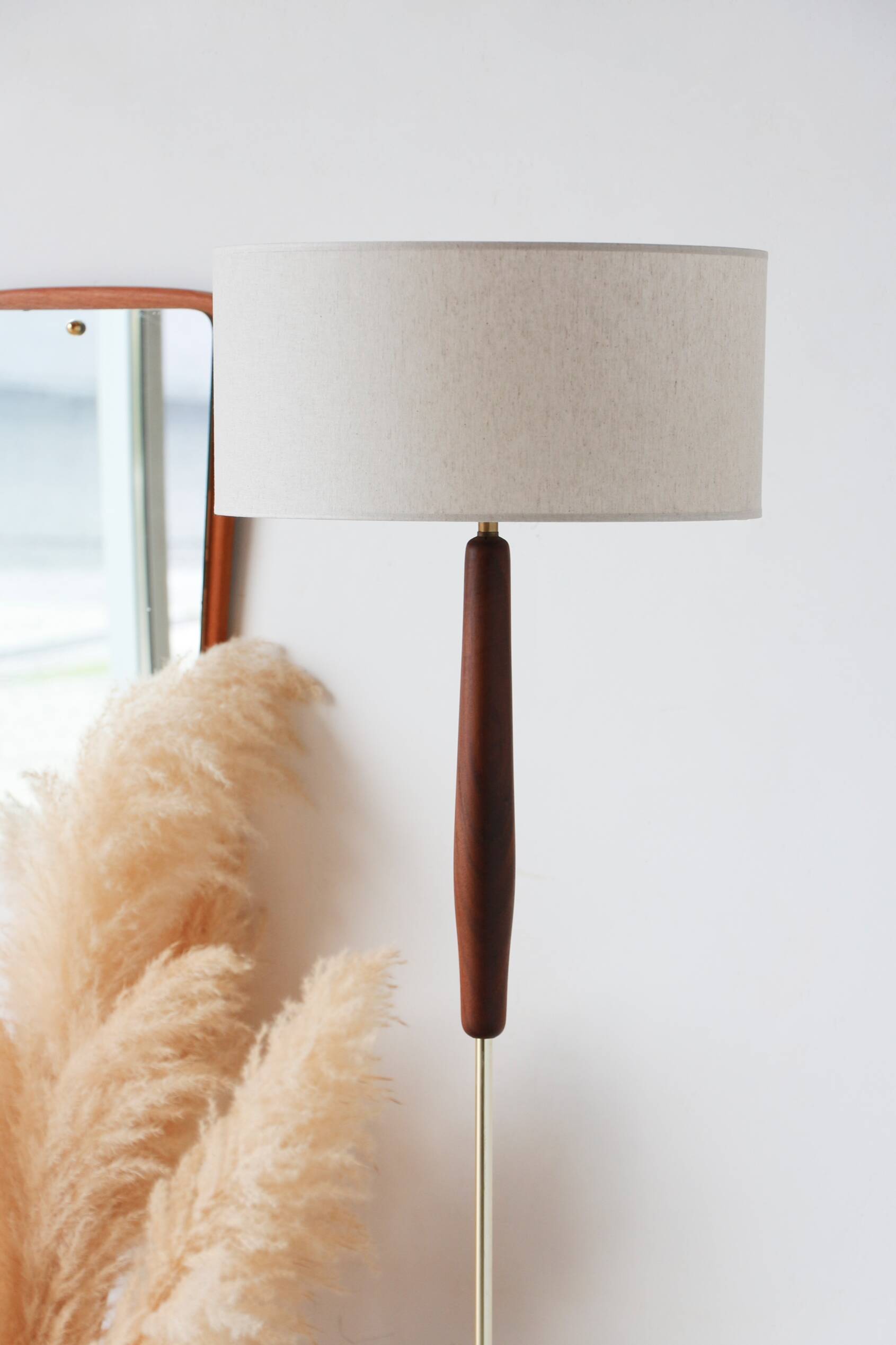 Vintage floor lamp in teak and brass with a cream shade.