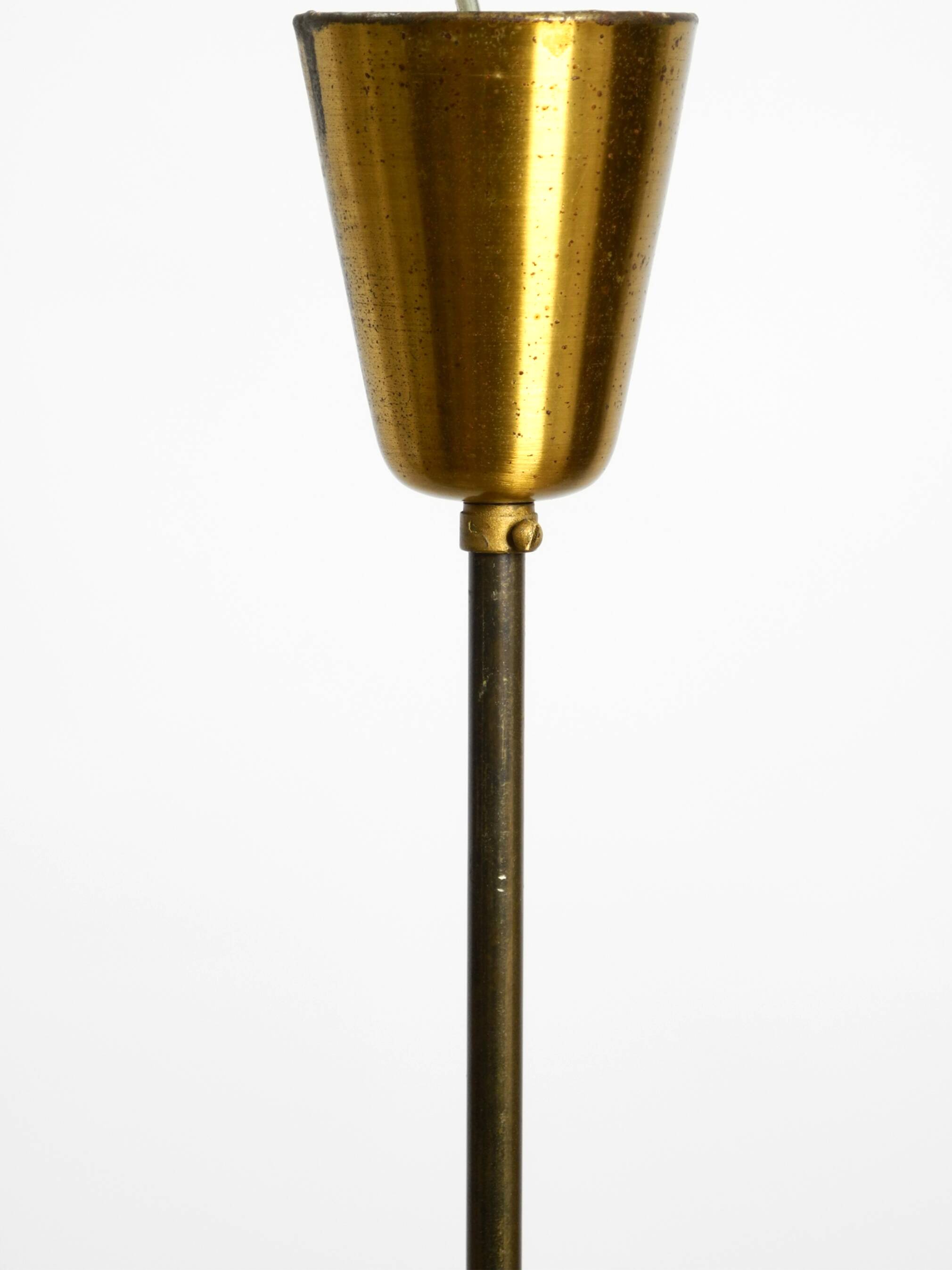 Mid Century brass ceiling lamp with a curved perforated sheet lampshade