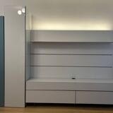 Low furniture, paneling and two-column Globo composition by Roche Bobois.