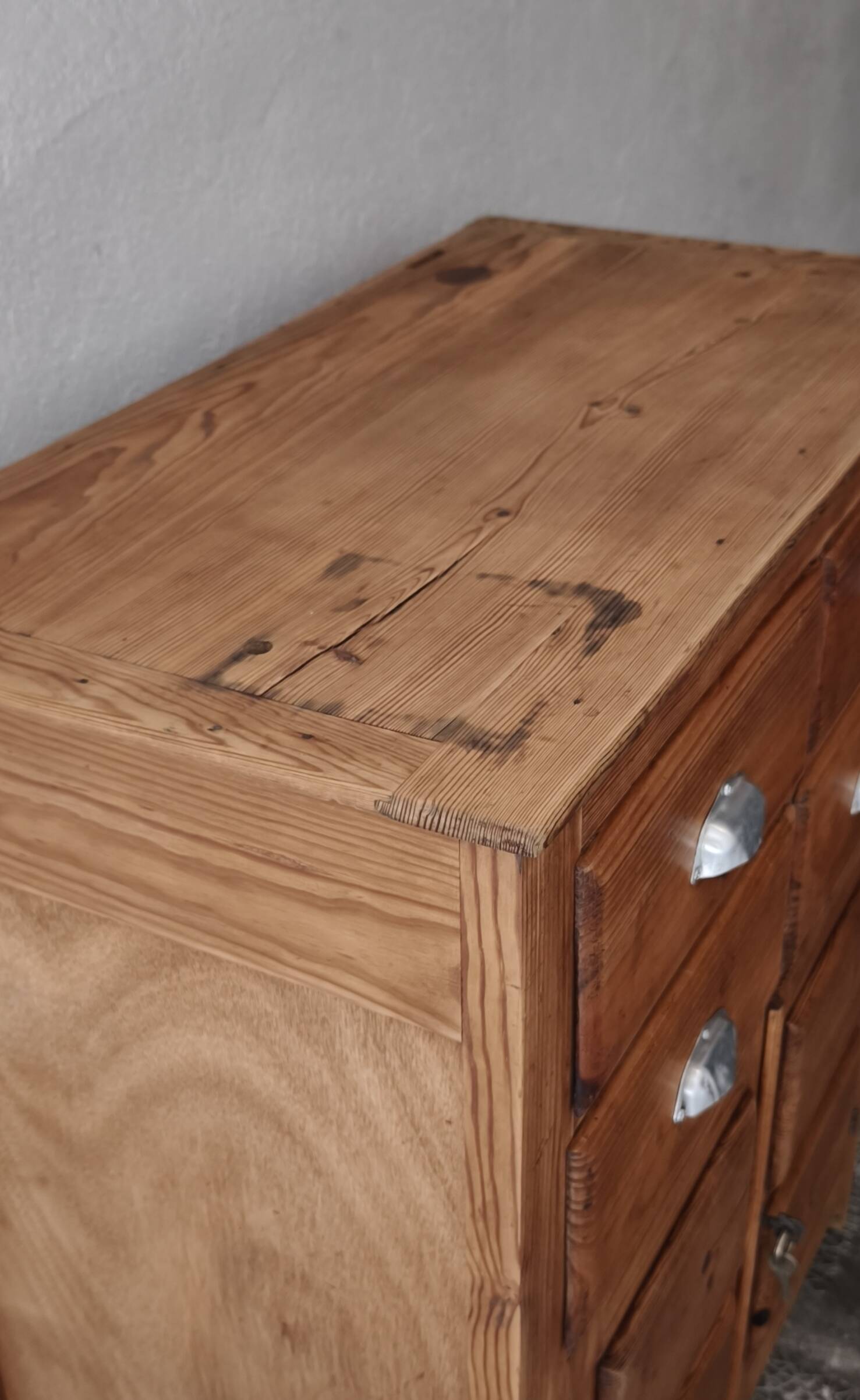 Small antique workshop furniture made of solid wood.