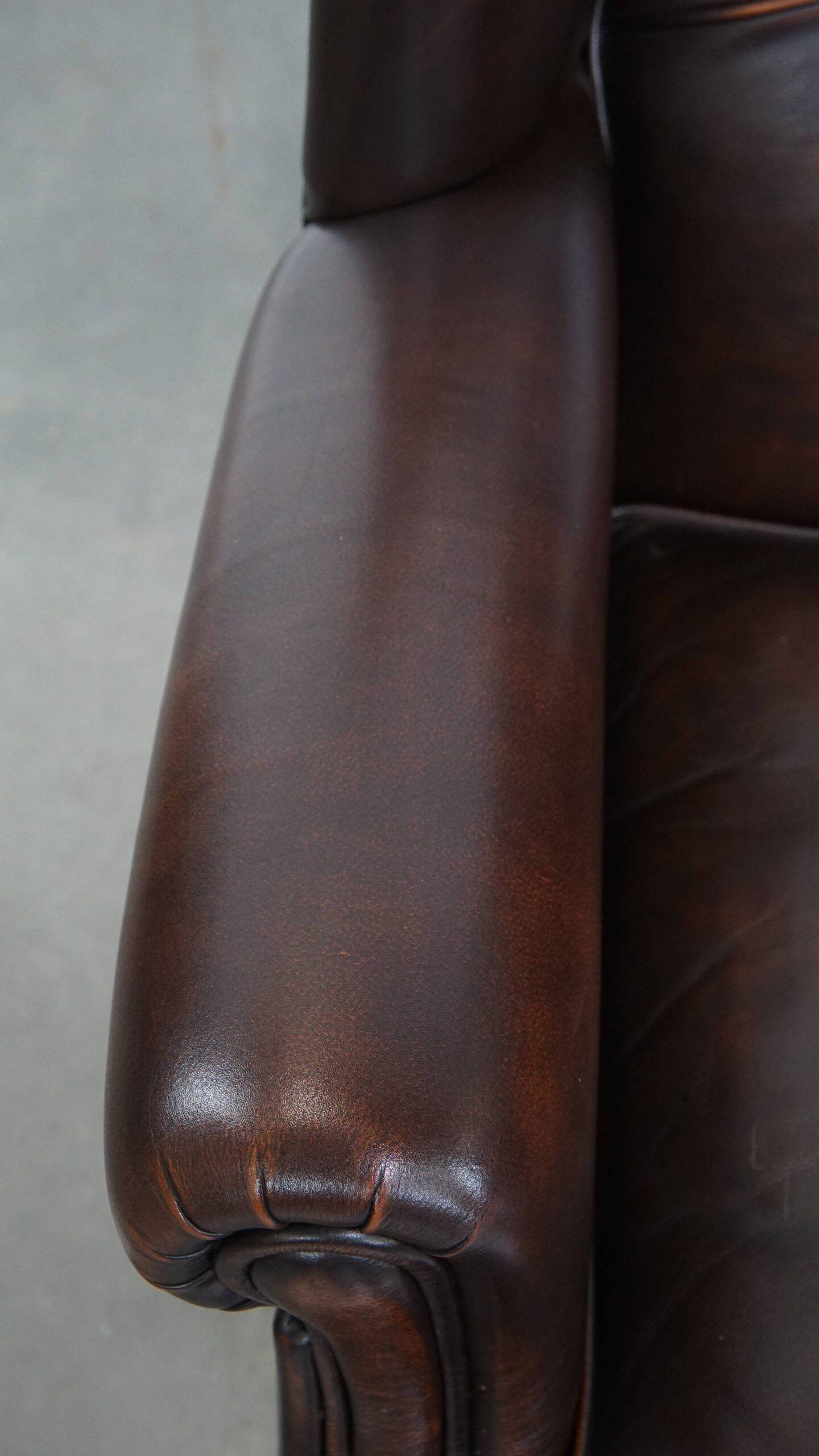 Comfortable and very beautiful set of 2 cow leather wingback armchairs in English style