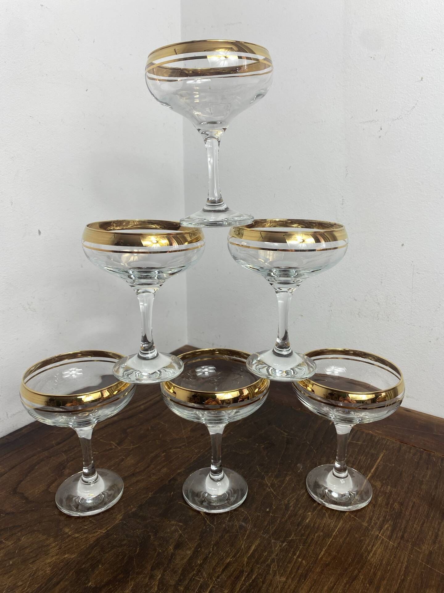 Champagne coupes or cocktail glasses with gilding