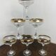 Champagne coupes or cocktail glasses with gilding