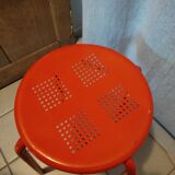 Red patinated metal stool