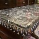 Antique English mahogany dressing table with carved details, black marble, and mirror.