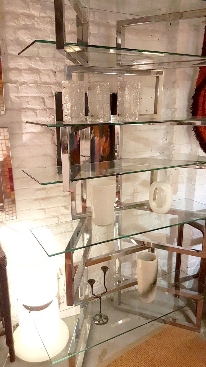 Articulated presentation shelf in chrome and glass. Italy 1970s