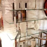 Articulated presentation shelf in chrome and glass. Italy 1970s