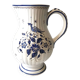 Moutiers earthenware jug, hand-painted blue decoration.