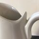 Broc in white fire porcelain with large spout