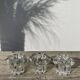 Trio of small, clear glass candle holders