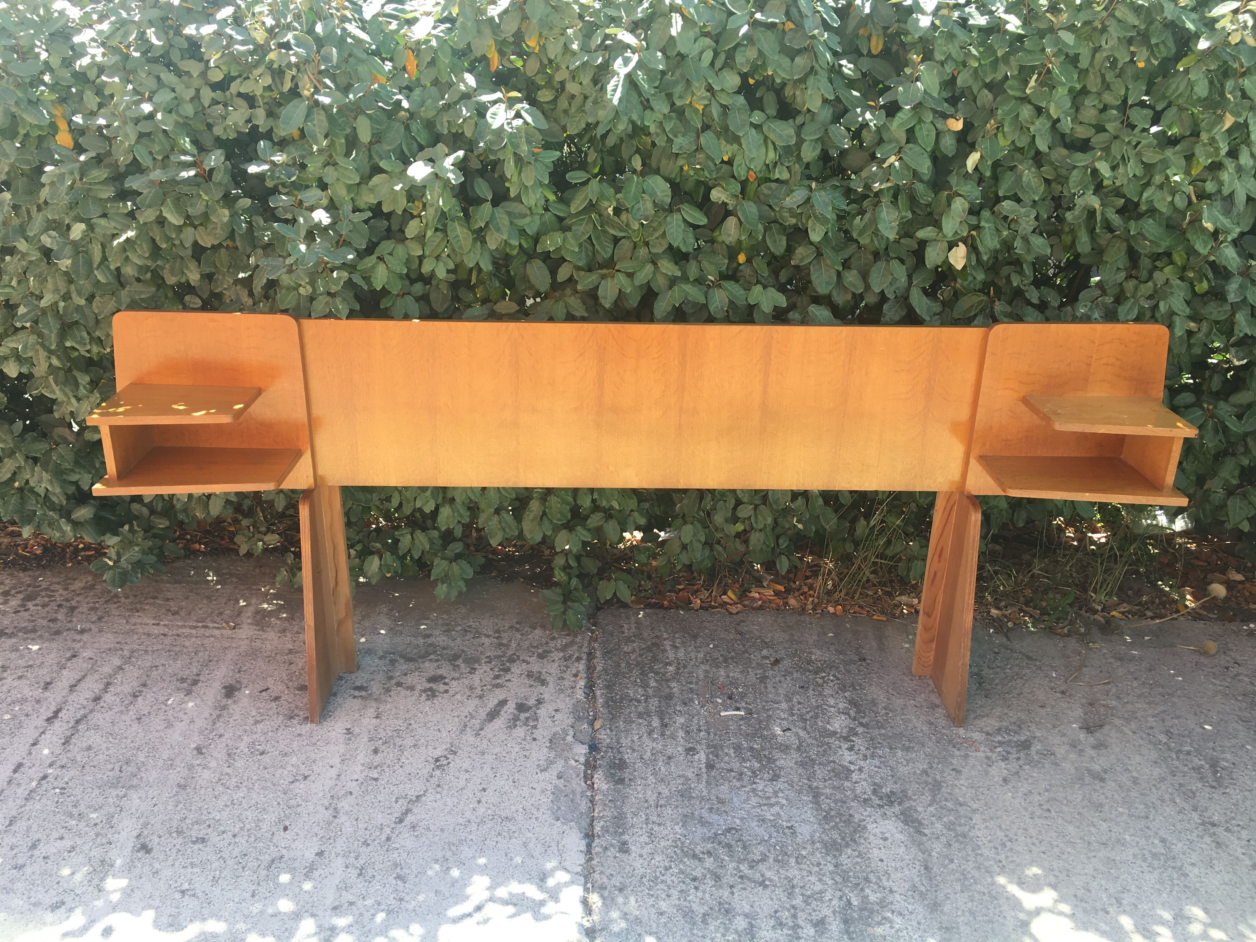 Vintage headboard with hanging bedside tables