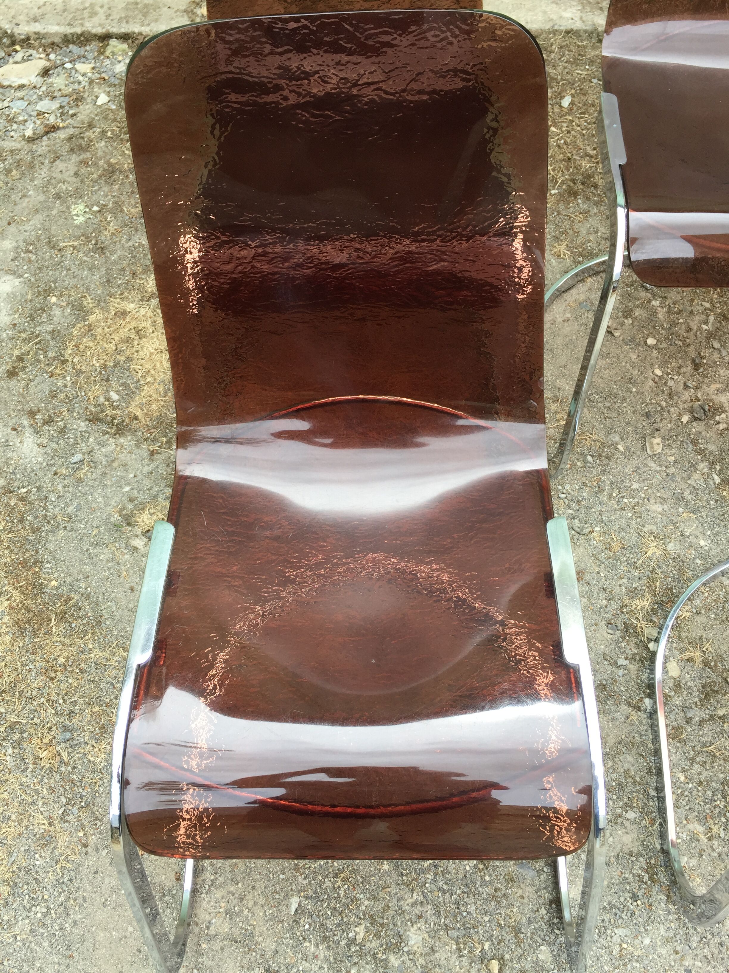 Chairs in plexiglas with chrome metal base