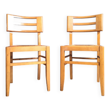 Pair of designer chairs by Pierre Cruège, antique seating furniture.